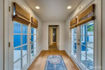 The breezeway takes you the primary suite with the private courtyards on the right and left.