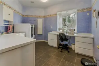 Laundry and Craft room with utility sink and built-in ironing board