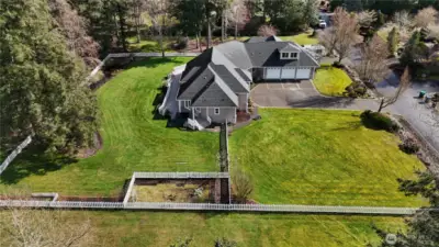 So much room for your own ideas! Keep the pristine lawn? Add more garden space? Look into building a shop?