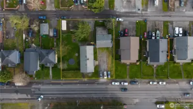 Yellow outlines the approximate perimeter of the property. Ample parking in front and in back.