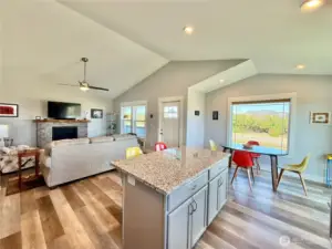 Propame fireplace with custom stone surround and live-edge mantle.