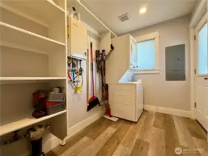 Mud/utility room with door leading to the side driveway.
