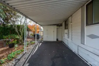 Your one car carport on the east side of your home with storage cabinets for yard tools or extra items you don't use often