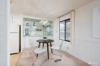 A nicely appointed dining room complete with built in cabinets to use as you please