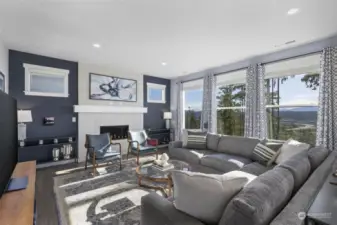 Gas fireplace in large living room with navy blue accent walls