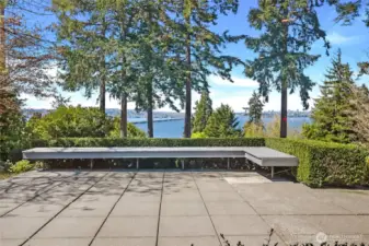 Savor sunny afternoons and sweeping Lake Washington views from your private, landscaped retreat—complete with charming bench seating nestled among the greenery.