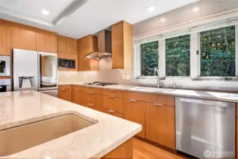 Featuring top-of-the-line Miele appliances, stunning stone countertops, and custom cabinetry, this kitchen blends function and style effortlessly.