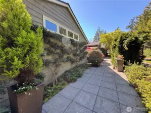 The entry walkways are beautifully framed by mature landscaping, perfectly complementing the natural surroundings and setting the tone for what lies beyond.