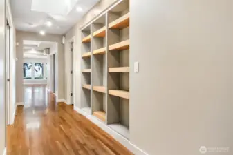 Thoughtfully designed with smart, built-in shelving crafted from natural wood