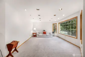 Large formal living room with lots of natural light