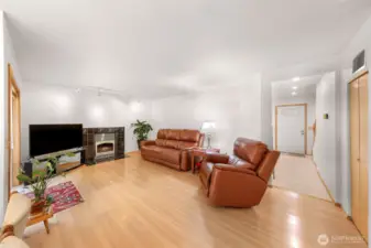 Second living room with gas fireplace and open concept to dining and kitchen