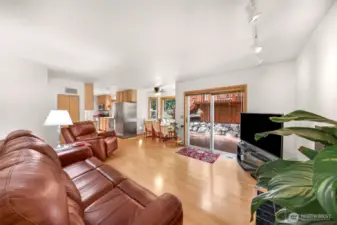 Living room has sliding doors to beautiful outdoor deck & entertainment space