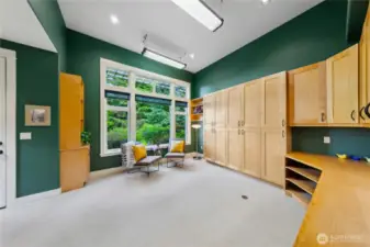 The studio is large, with more storage cabinets than you could ever fill. A built-in desk and its own exterior door.