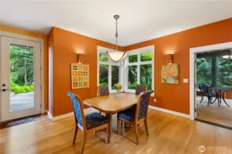 The dining area is just off the kitchen and the door leading to the screened porch. Great for entertaining.