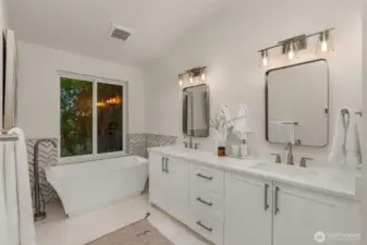 Primary ensuite features heated floors, double quartz vanity sink, a water closet and walk-in shower.