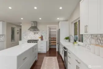 Kitchen features a coffee bar, walk-in pantry, double waterfall islands and Viking appliances.