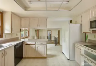 Kitchen looking into Breakfast Nook and Family Room