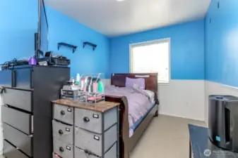 Front left bedroom with bead board added touch.