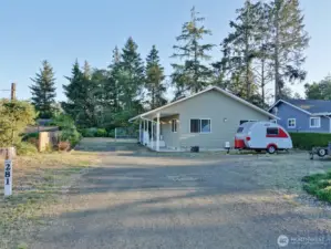 Front of the Home with a huge driveway.