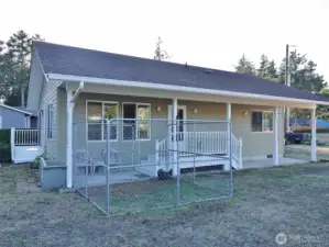 East-side of the house w/ fenced Dog Area.