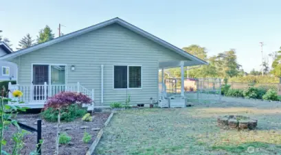 Rear of the Home w/ Landscaped and Level Backyard.