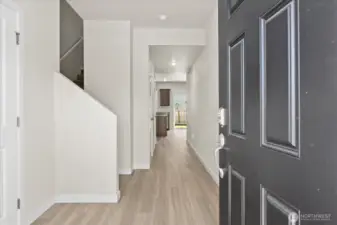 Enter this 2021 craftsman style home to an oversized entry way with luxury vinyl plank flooring.