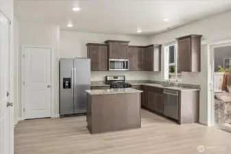 The kitchen features granite countertops, wood cabinetry with crown molding, a pantry with built-in shelving, and stainless steel appliances including a gas range, and a WiFi-enabled dishwasher.