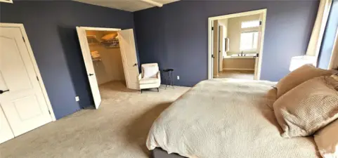 Double door entries to room, walk-in closet and bath