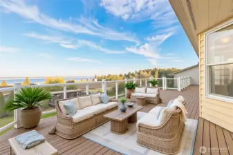 Large deck off the Living room / Great room. You can enjoy the vast open skies and see the Northern Lights, stargazing, sunrises and the sky glow sunsets. *Virtually staged*