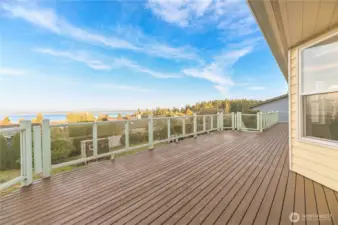 Large deck wraps all the way around to the other side of the home.