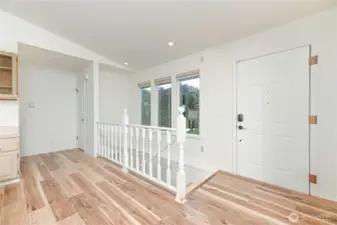 Main entry with accessibility sized entry door. Stairs to the lower level living.