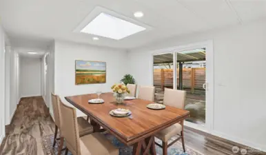 Dining area large enough for table and 6 chairs with skylight