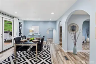 A few steps down from the dining room is the pantry, 1/4 bath with laundry & bonus area