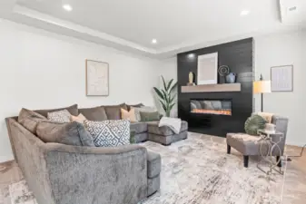 Spacious living room with lovely fireplace.