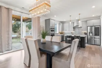 Glass slider leads to backyard.