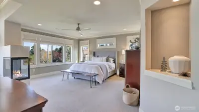 o Expansive primary suite  o Go to sleep with a view of the city lights and wake up to spectacular views of the lake and mountains.  o Cozy three-side gas fireplace.  o Sitting area  o Wired for TV and mount  o Large walk-in closet   o Spa-like primary bath and huge shower.   o Private balcony to take in the morning views with your cup of coffee