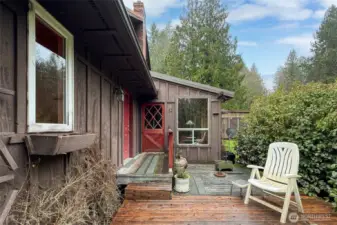 Deck area off enclosed porch.