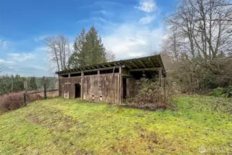 2 stall barn by road. with pasture going towards house and 2nd barn.