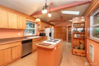 Kitchen with island cooking.
