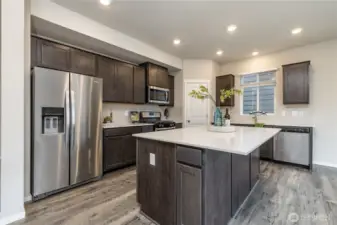 Gorgeous kitchen with oversized island and quartz countertops