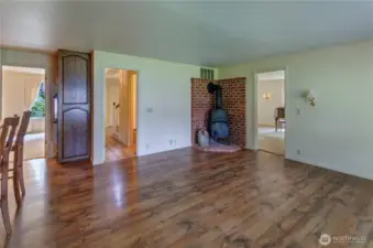 Family room looking towards dining, half bath and living room.