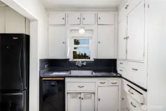 Cozy kitchen has all the necessities.