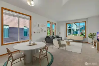 Virtually staged dining and living area.