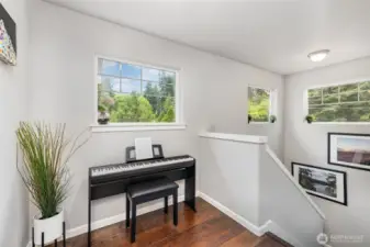 So much light! This is the little nook at the top of the stairs which makes a perfect music area, mini-office or homework space!