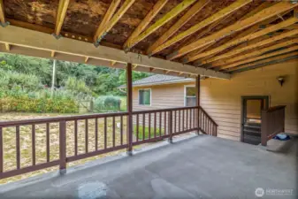 From covered deck into main floor or basement
