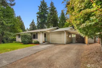 Perfectly centered on the 1/4 acre lot, behind a stunning row of evergreens, located in a friendly neighborhood just 5 minutes from Vashon town core - where you will find everything you need to enjoy island life. Added bonus is the 2 covered parking spaces with even more room to park in the driveway.