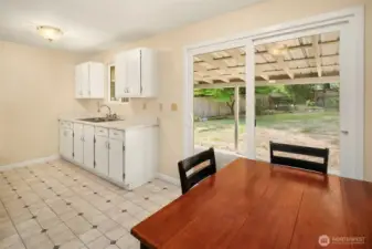 An efficient kitchen, right off the living room, has dining space and access to your private, peaceful backyard.