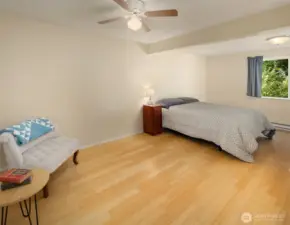 The primary bedroom boasts a private 1/2 bathroom and has access to the back patio through a sliding glass door.