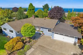 Beautiful Gregory Heights home with lush landscaping and great potential for Sound views