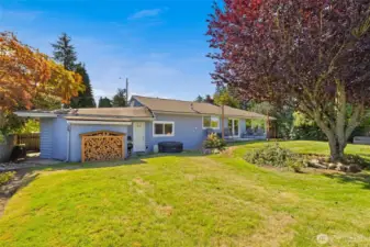 Fully fenced outdoor space with room for gardening or gatherings